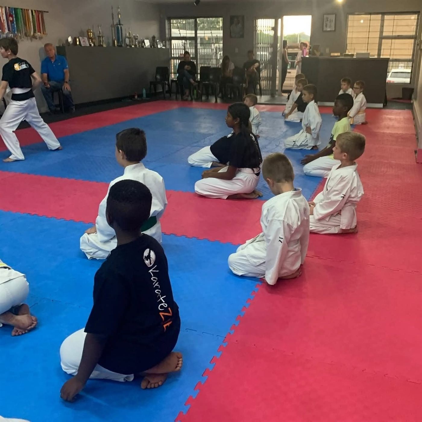 Children kneeling in a KarateZone class